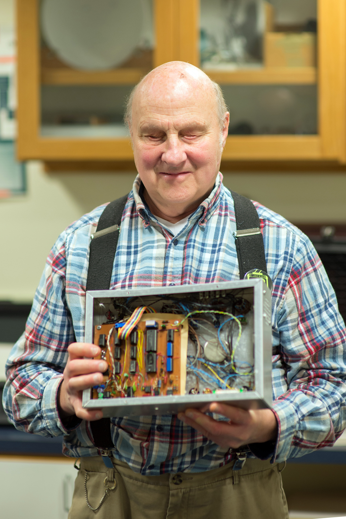 Portrait of Bill Gerrey holding one of his devices