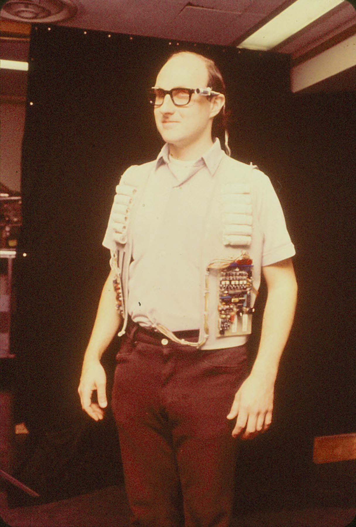 Photograph of Bill Gerrey testing out a TVSS device