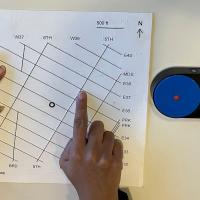 Participant shown using MapIO to interact with a TMAP. Bluetooth buttons are to the right of the TMAP.